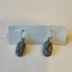Kendra Scott drop earrings.